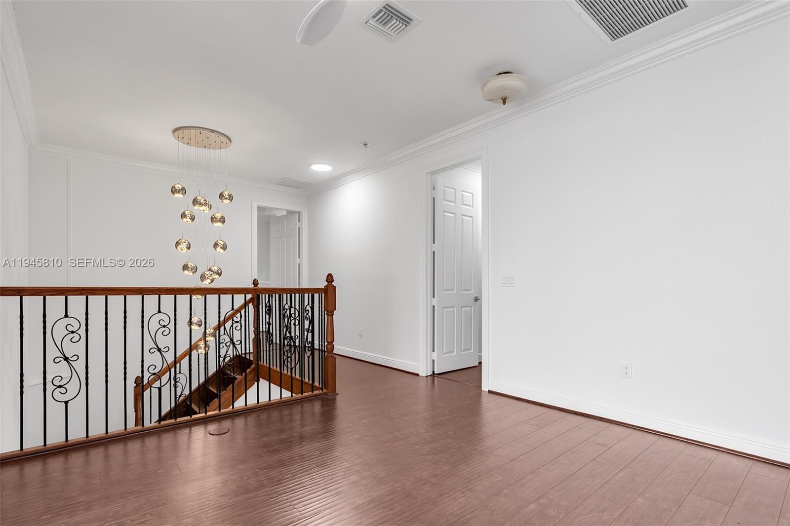 17809 Southwest 54th Street Miramar, FL 33029 - Photo 59 of 94 a view of a hallway with wooden floor and windows