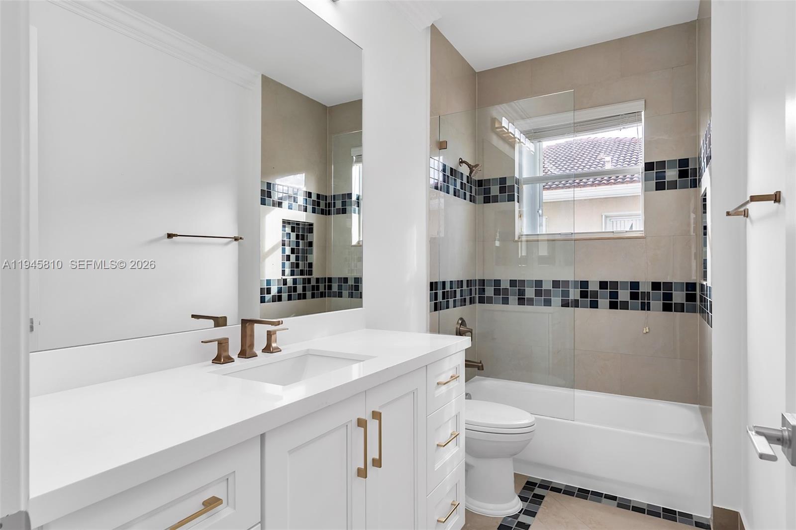 17809 Southwest 54th Street Miramar, FL 33029 - Photo 63 of 94 a bathroom with a sink a toilet and shower