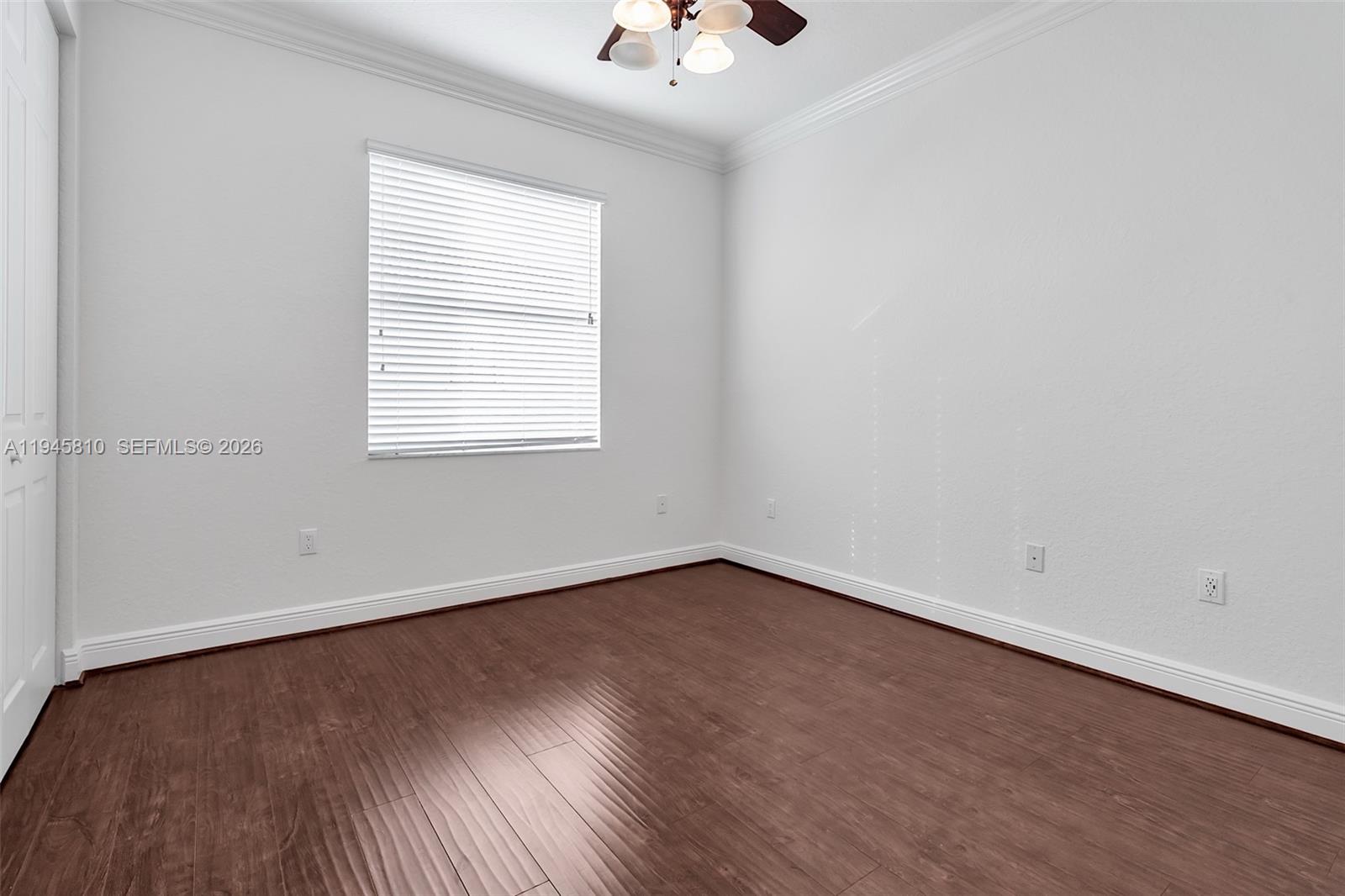 17809 Southwest 54th Street Miramar, FL 33029 - Photo 66 of 94 an empty room with a window and a ceiling fan