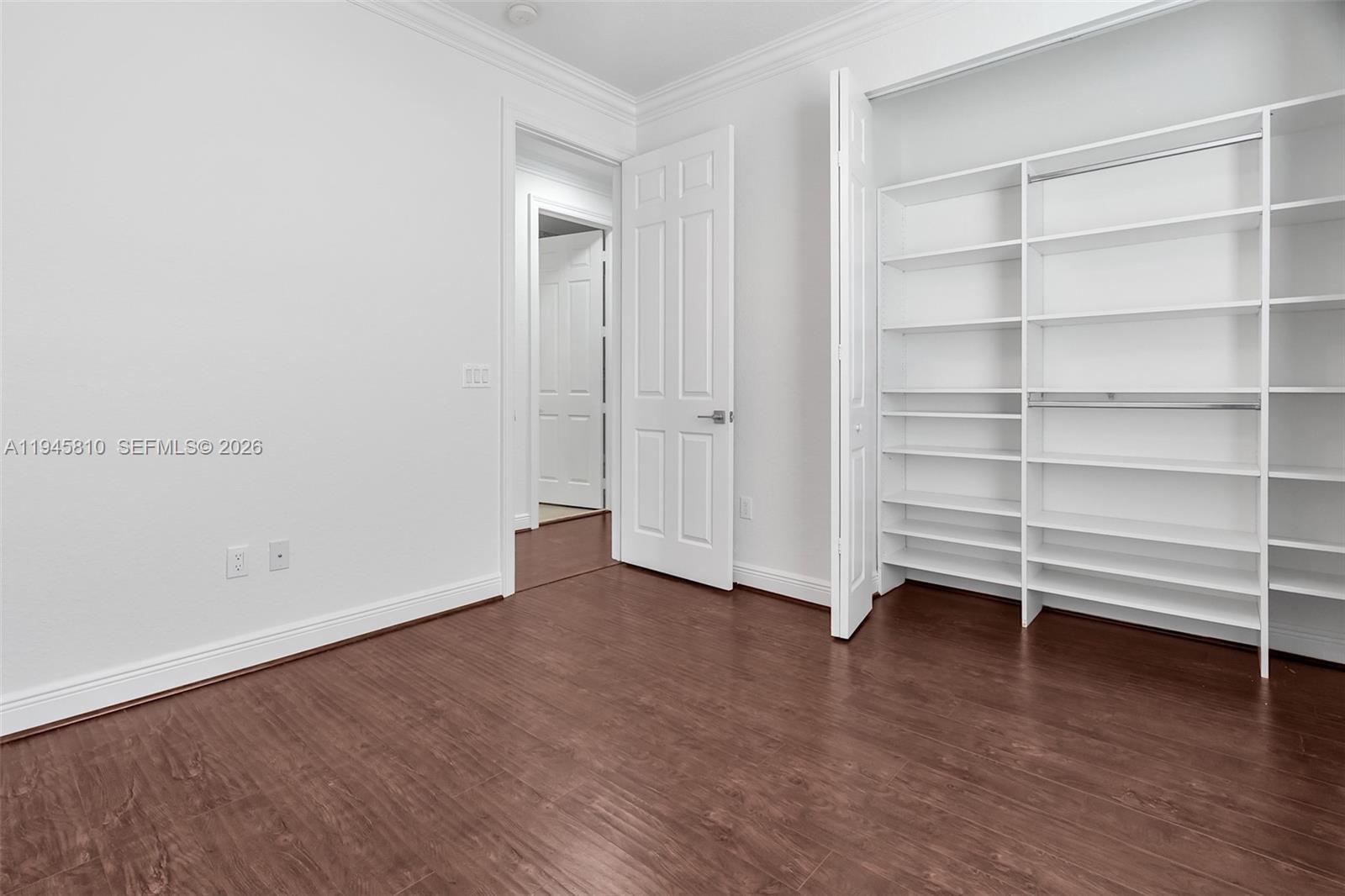 17809 Southwest 54th Street Miramar, FL 33029 - Photo 67 of 94 a view of an empty room with a window and wooden floor