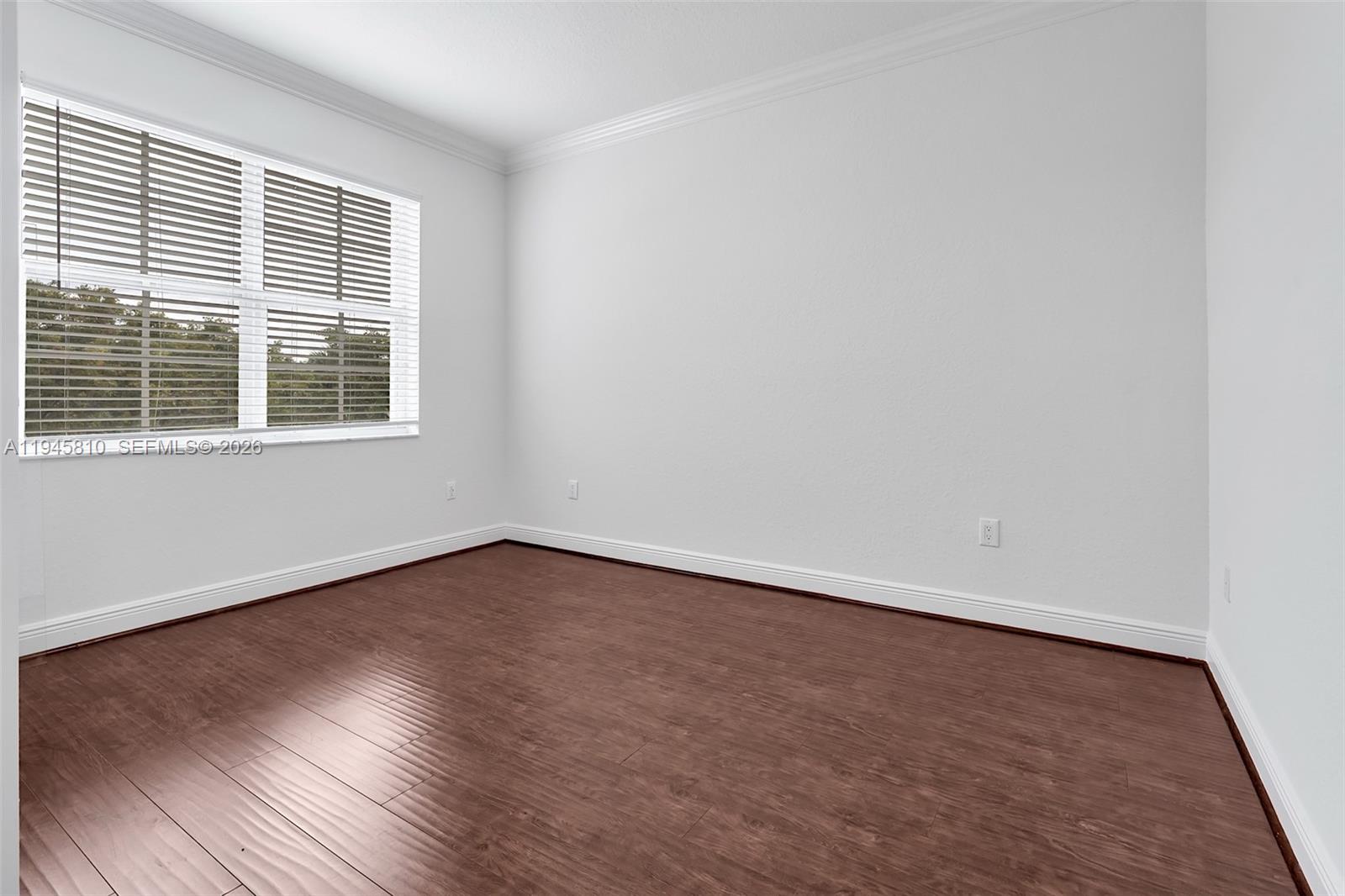 17809 Southwest 54th Street Miramar, FL 33029 - Photo 68 of 94 an empty room with wooden floor and windows