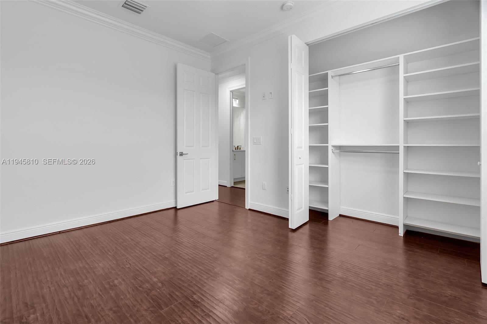 17809 Southwest 54th Street Miramar, FL 33029 - Photo 69 of 94 a view of an empty room with wooden floor and closet