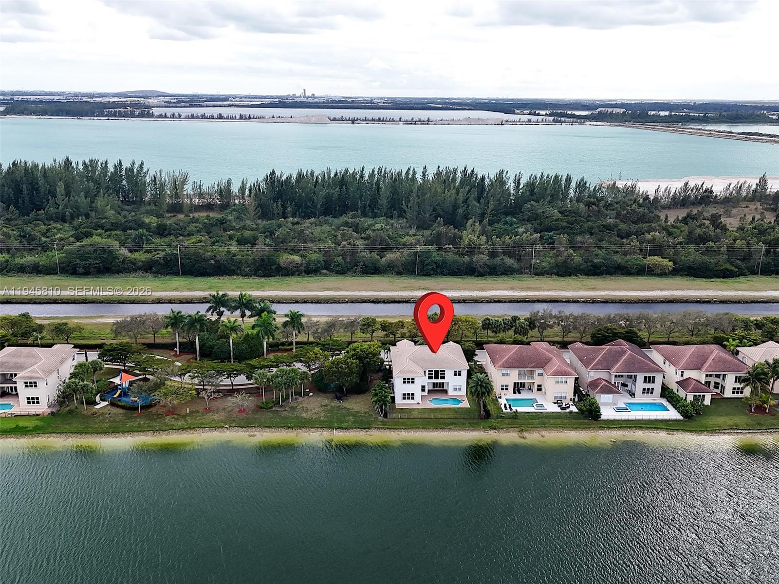 17809 Southwest 54th Street Miramar, FL 33029 - Photo 80 of 94 a view of a lake with a table and chairs