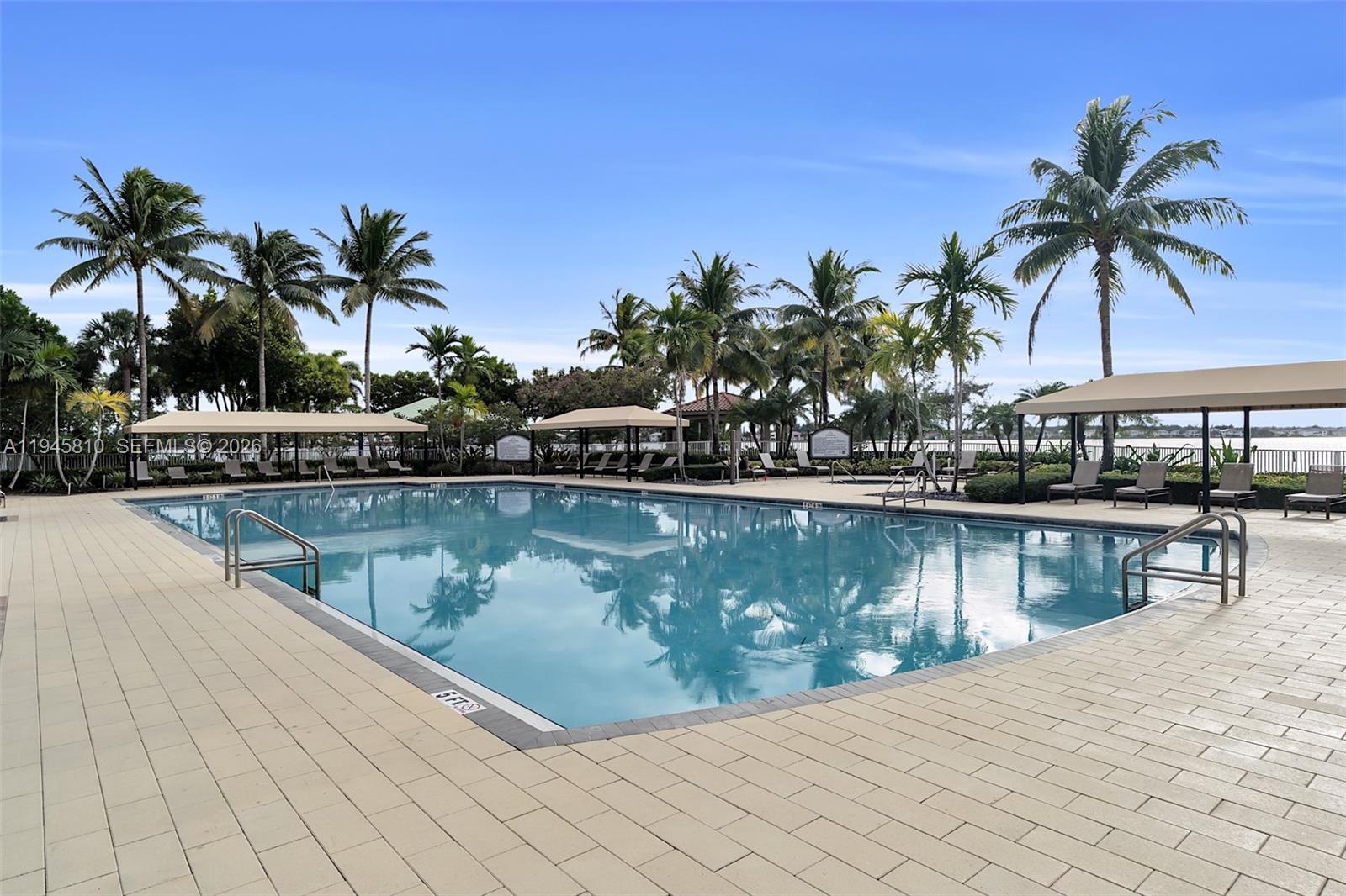 17809 Southwest 54th Street Miramar, FL 33029 - Photo 86 of 94 a view of swimming pool with a table and chairs