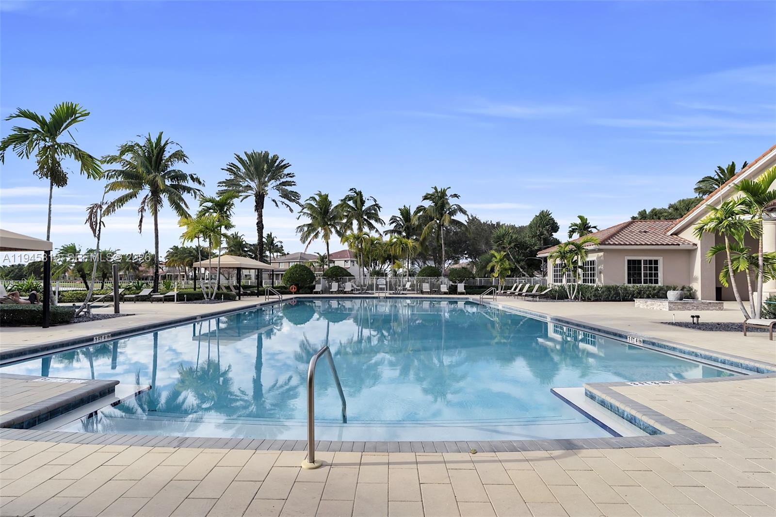 17809 Southwest 54th Street Miramar, FL 33029 - Photo 87 of 94 a view of swimming pool with outdoor seating and plants