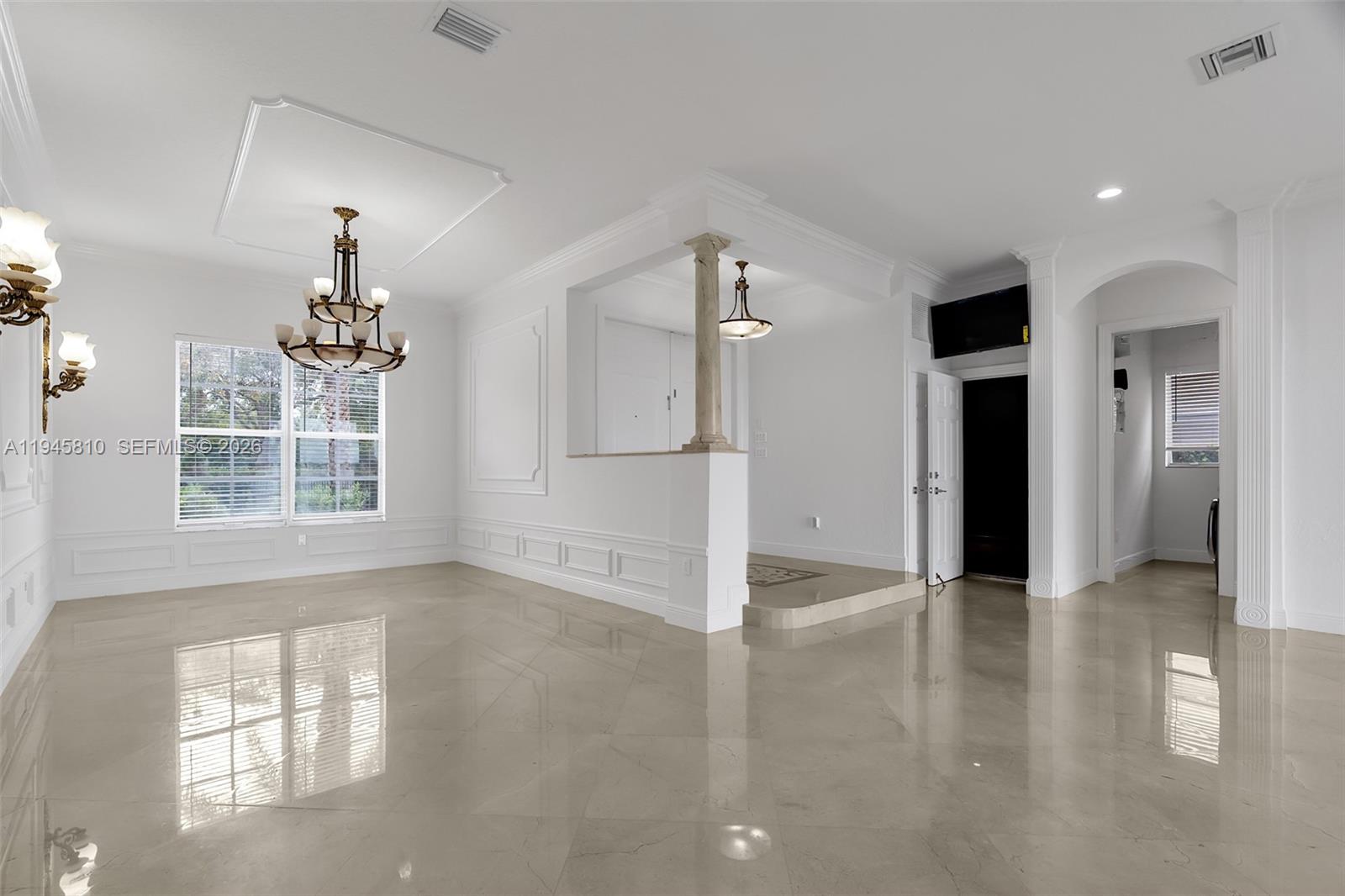 17809 Southwest 54th Street Miramar, FL 33029 - Photo 9 of 94 wooden floor in an empty room with a window