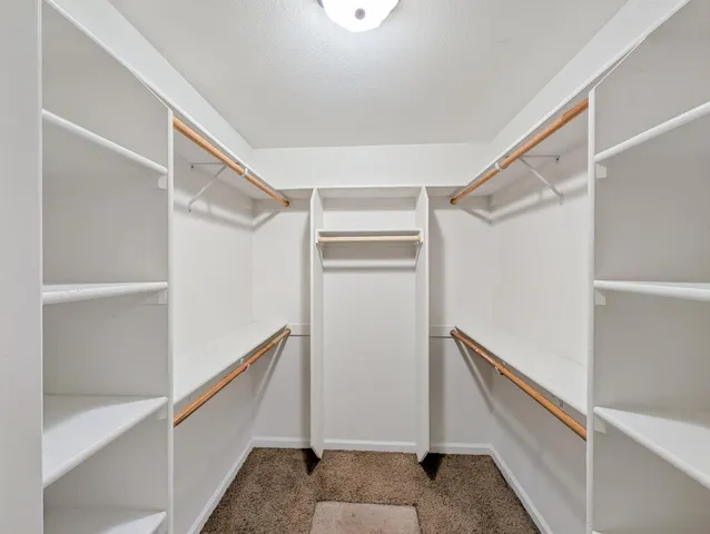 a view of an empty walk in closet