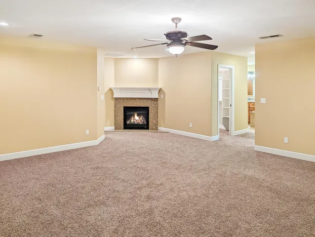 a view of an empty room with a fireplace