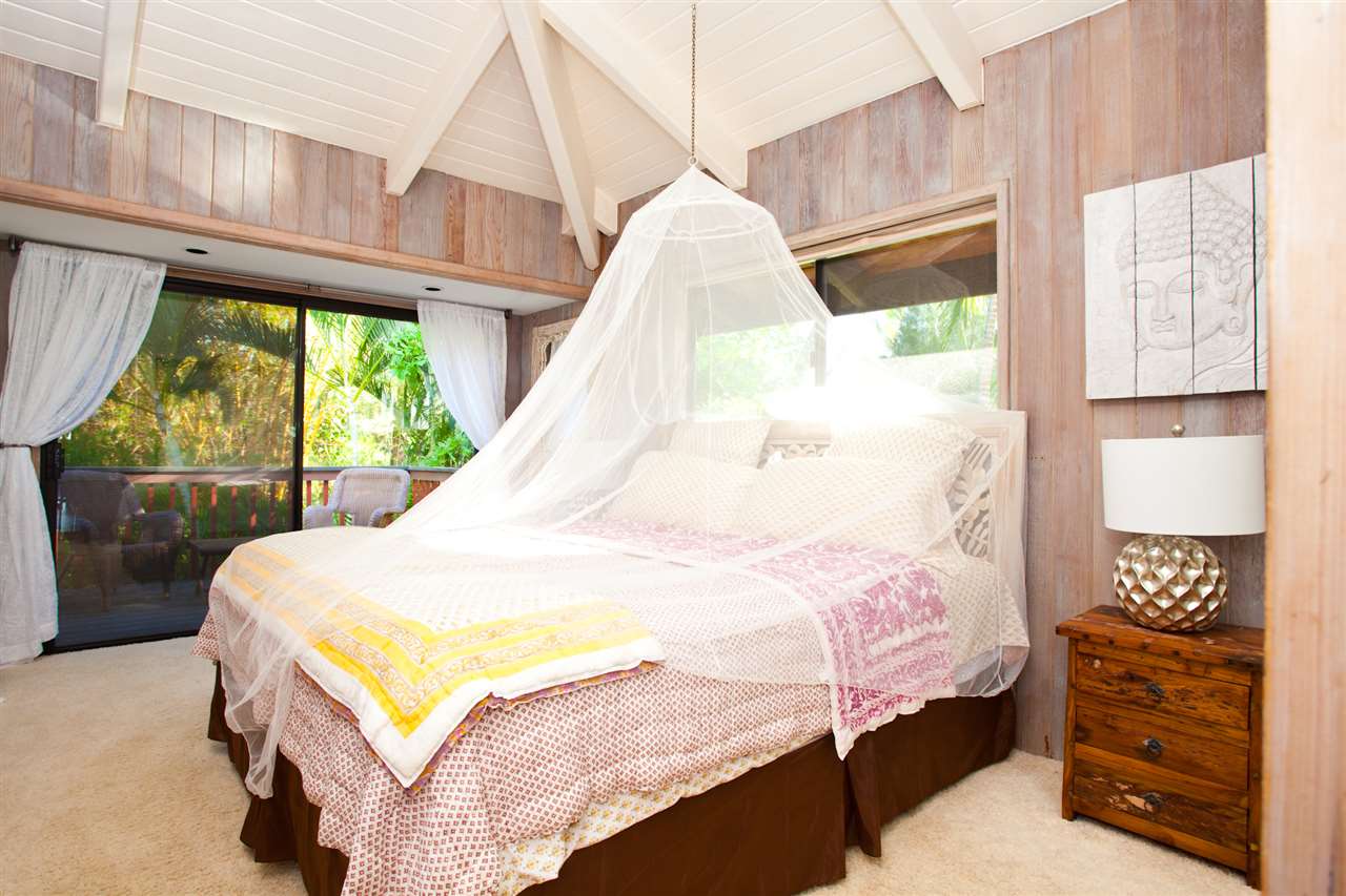 160 Nahele Road Haiku, HI 96708 - Photo 12 of 30 a bed sitting in a bedroom next to a window