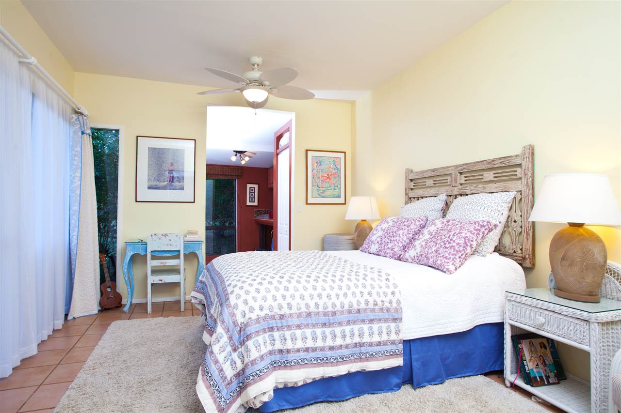 160 Nahele Road Haiku, HI 96708 - Photo 16 of 30 a bedroom with a bed and a fireplace