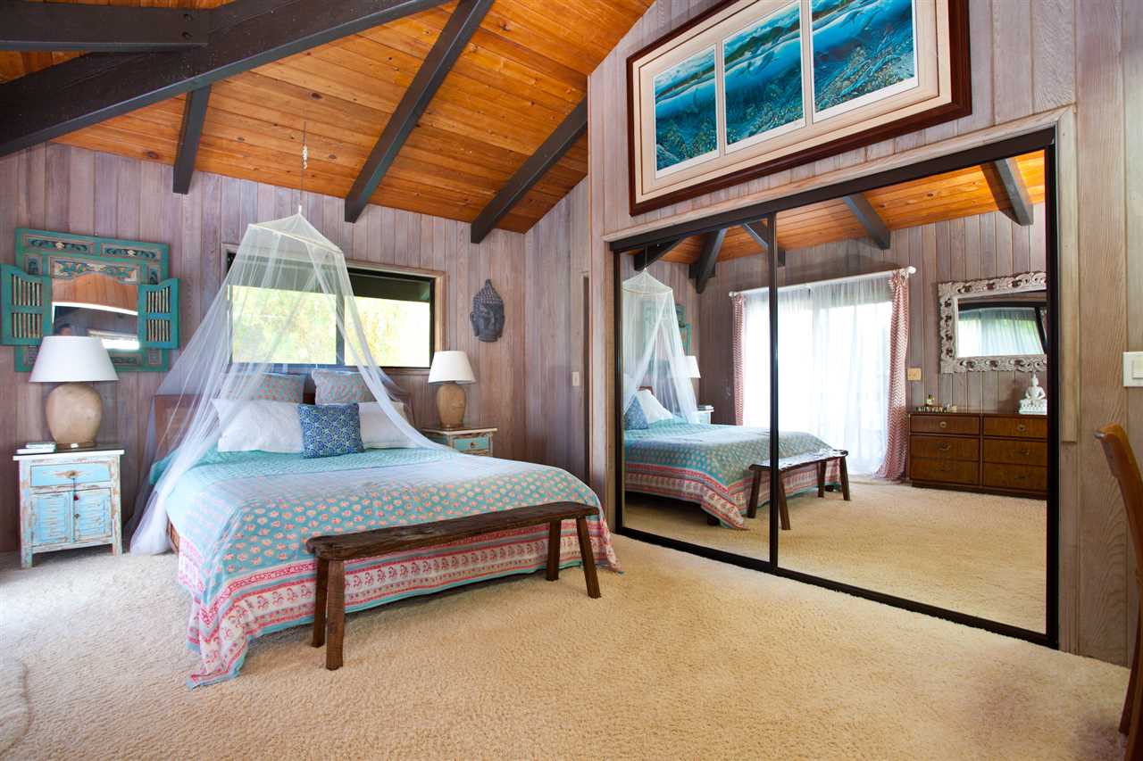 160 Nahele Road Haiku, HI 96708 - Photo 8 of 30 a bedroom with a bed and a large window