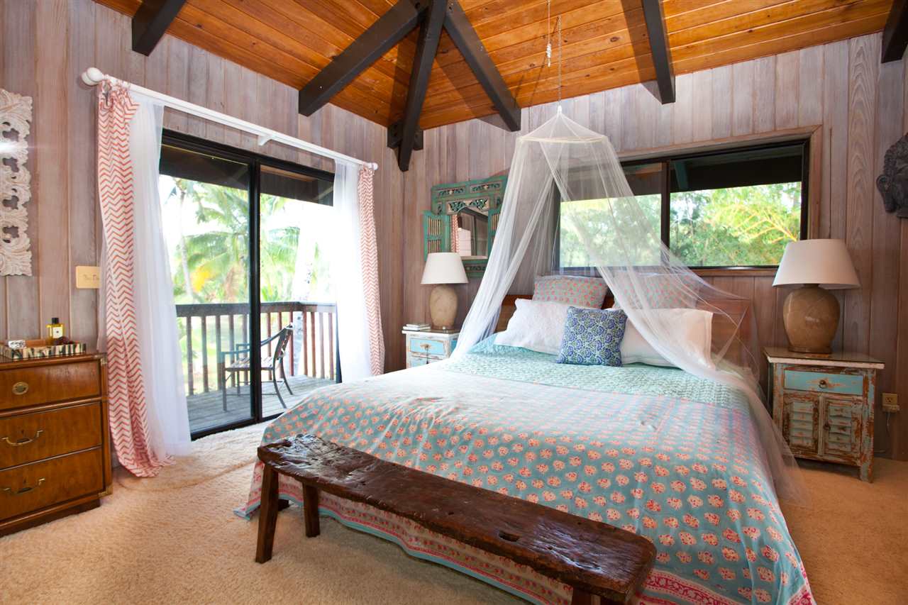 160 Nahele Road Haiku, HI 96708 - Photo 9 of 30 a bedroom with a bed and a large window