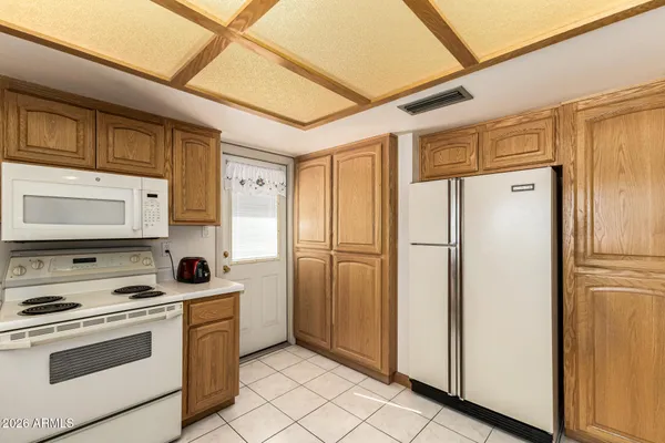 a kitchen with stainless steel appliances a refrigerator stove and sink