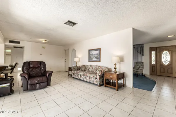 a living room with furniture and a window