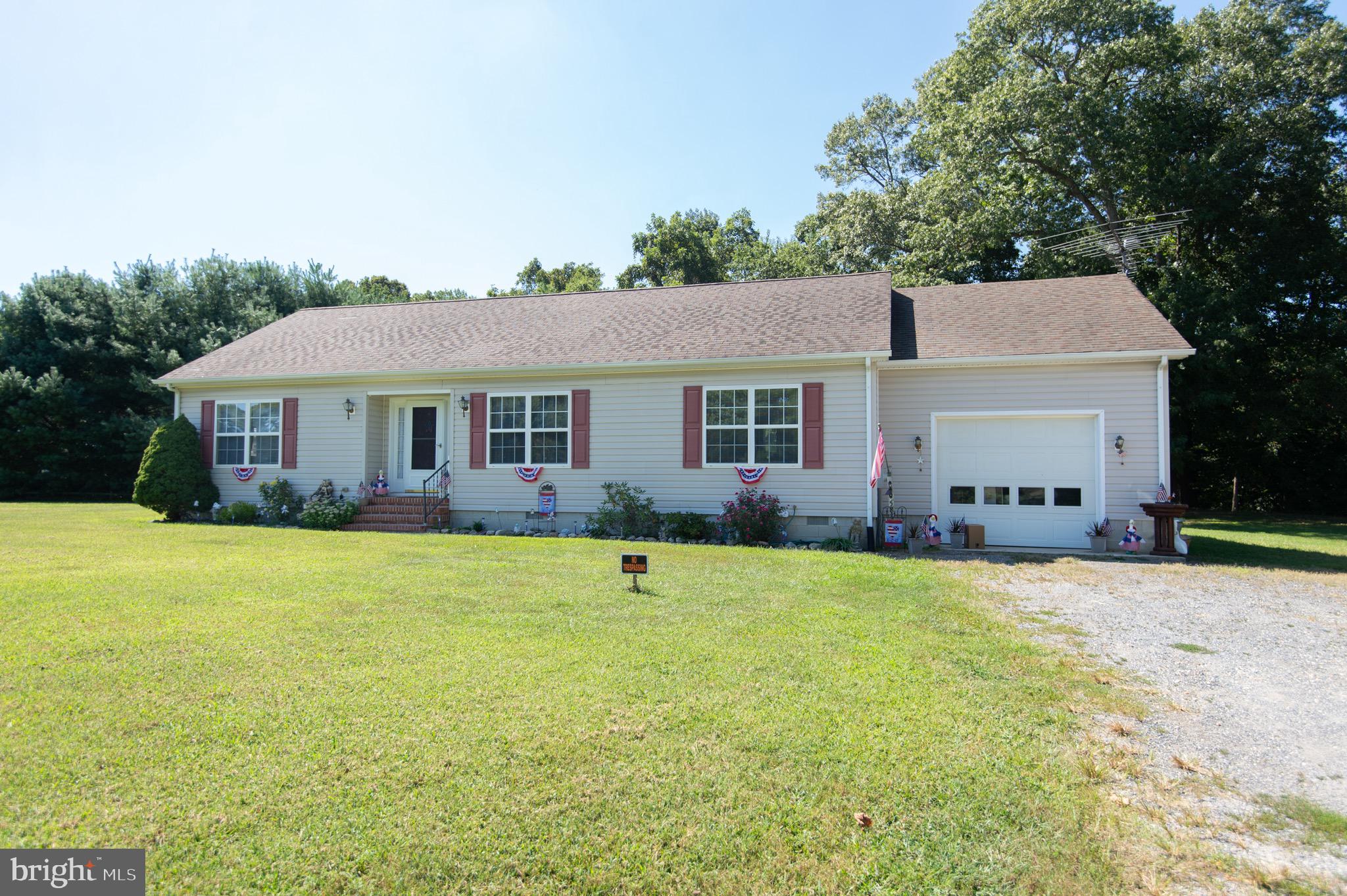 5834 Bell Creek Road Preston, MD 21655 - Photo 2 of 44 a front view of a house with a yard and trees
