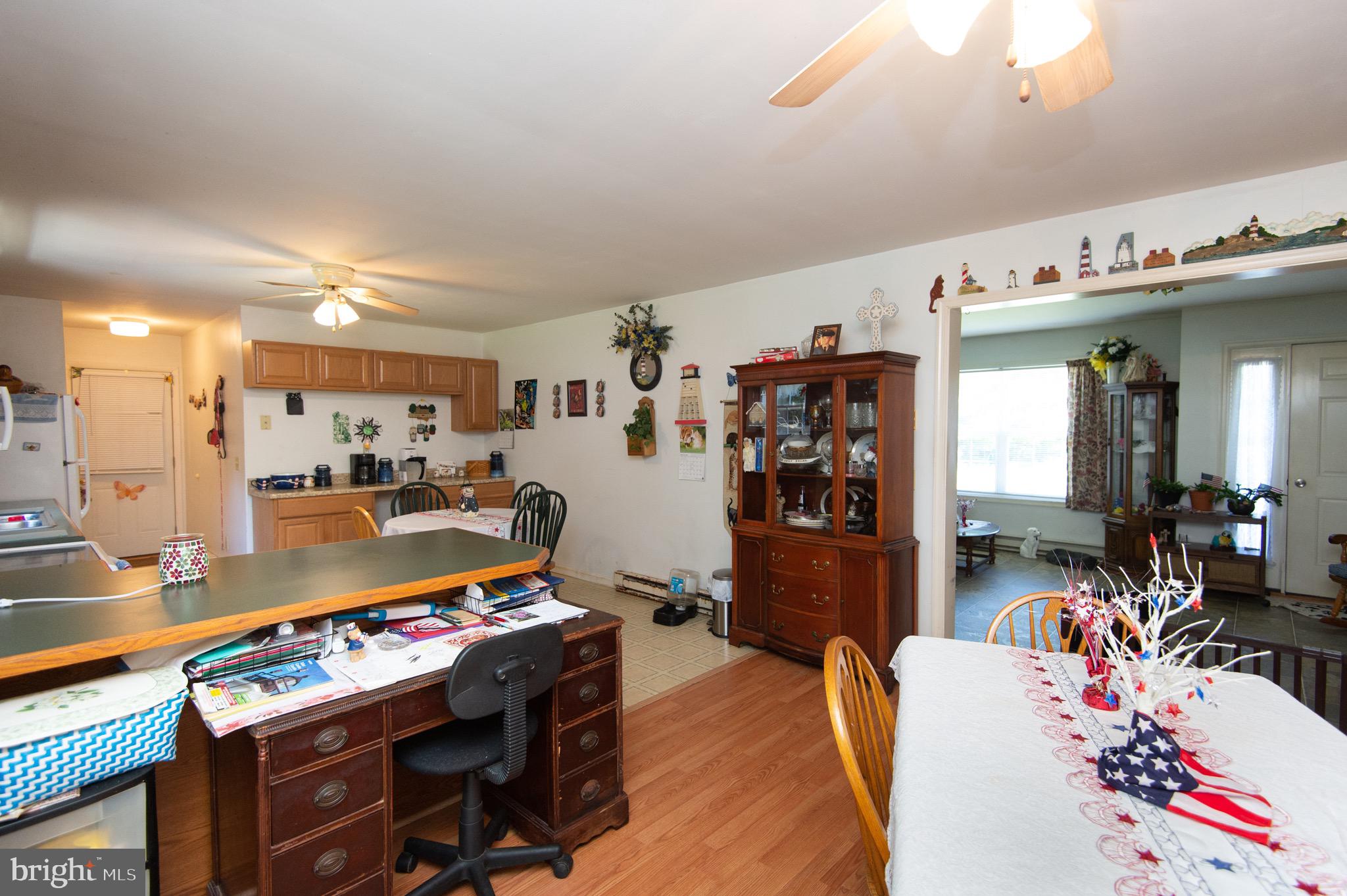 5834 Bell Creek Road Preston, MD 21655 - Photo 15 of 44 a living room with furniture and a flat screen tv