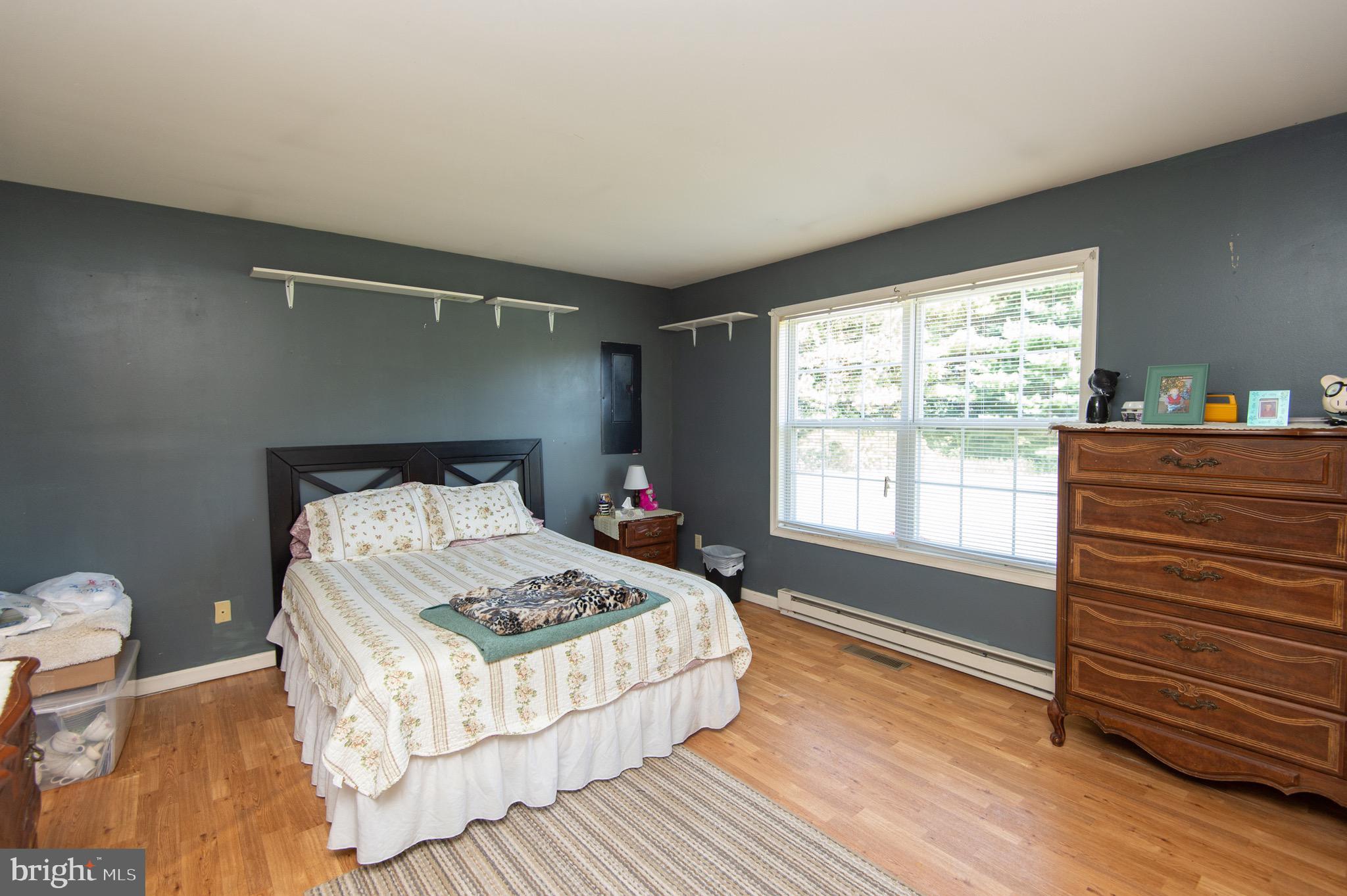 5834 Bell Creek Road Preston, MD 21655 - Photo 27 of 44 a bedroom with a bed and a window