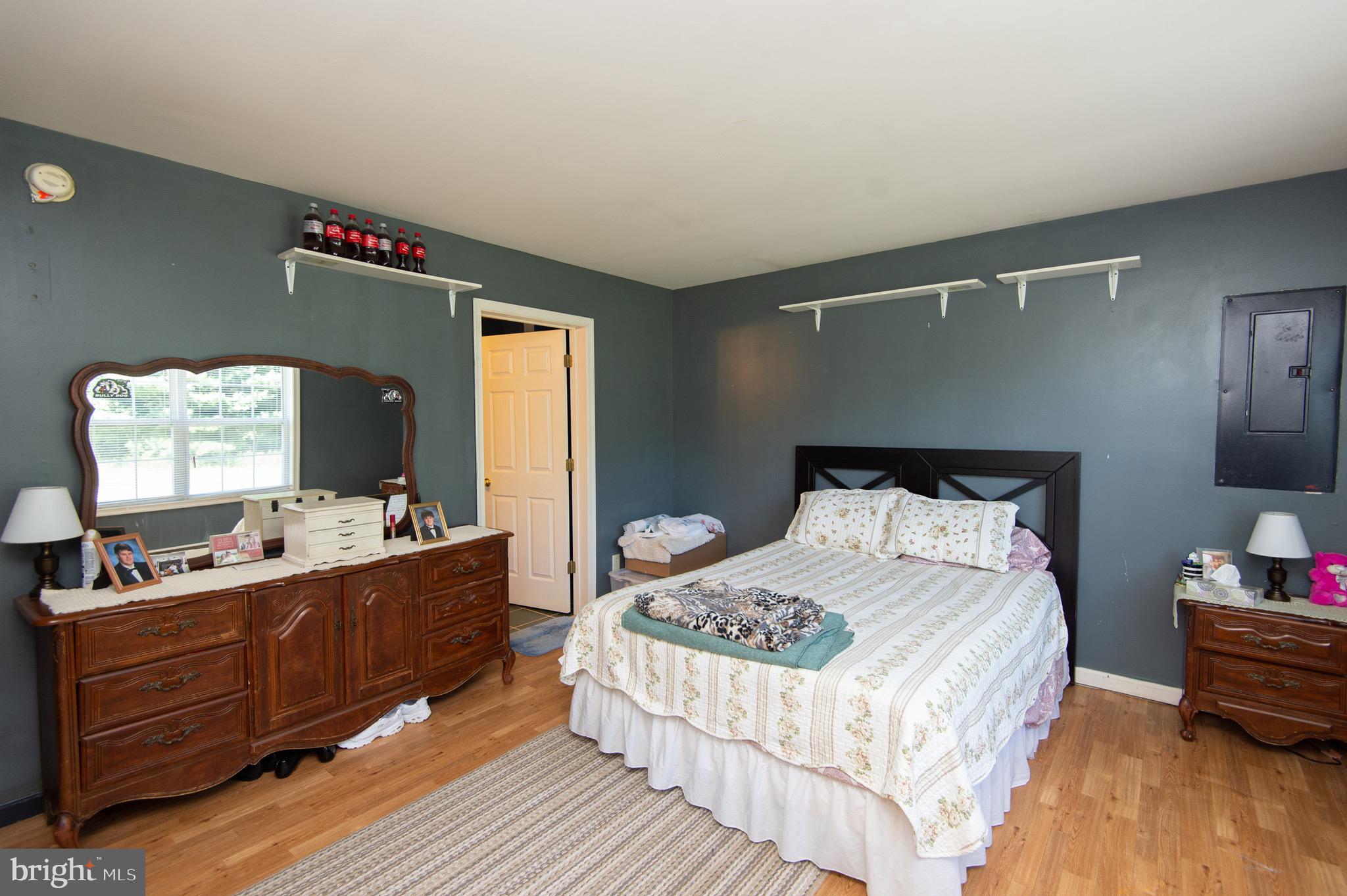 5834 Bell Creek Road Preston, MD 21655 - Photo 28 of 44 a bedroom with a bed and a dresser
