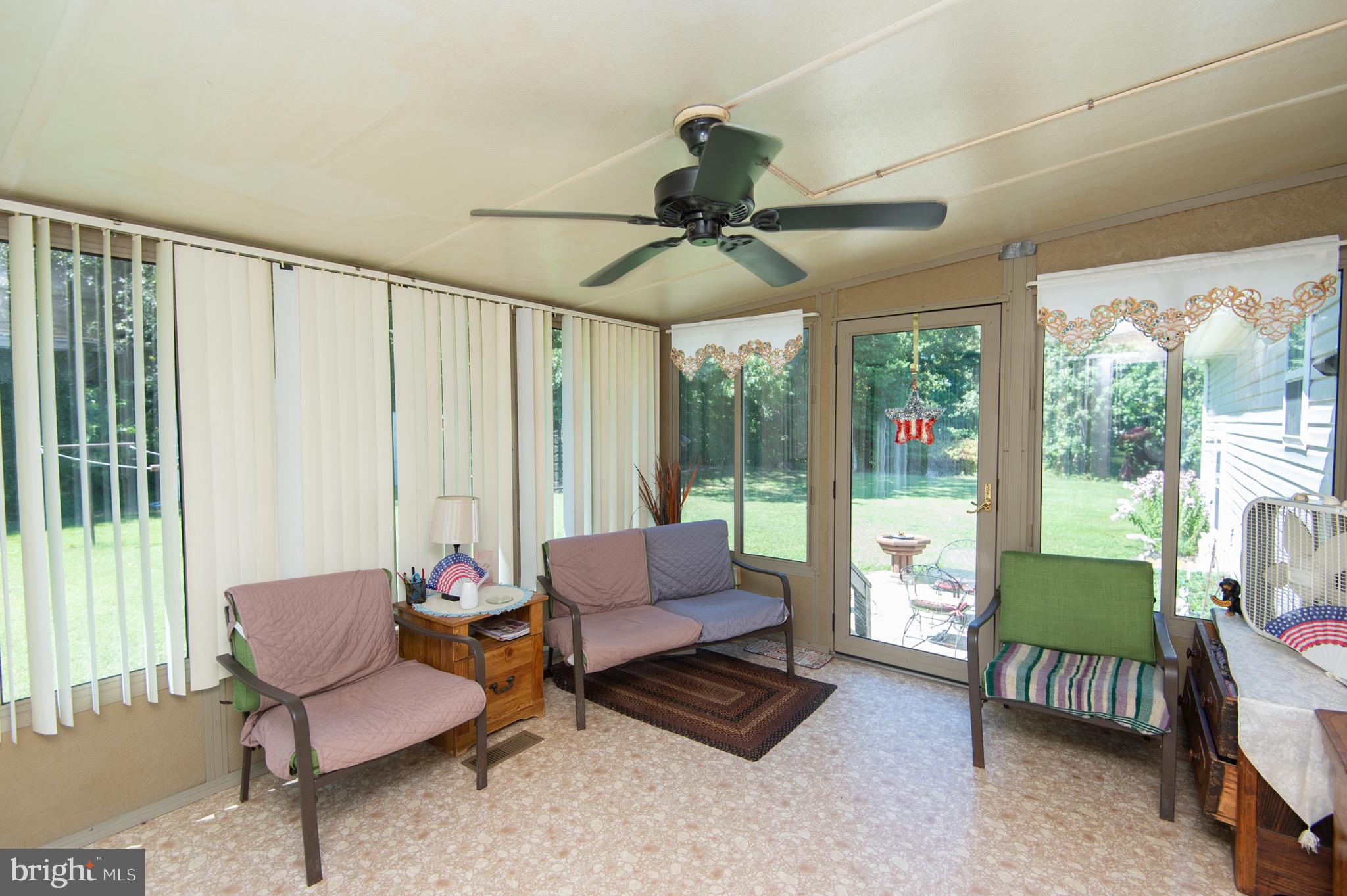 5834 Bell Creek Road Preston, MD 21655 - Photo 31 of 44 a living room with furniture and a large window