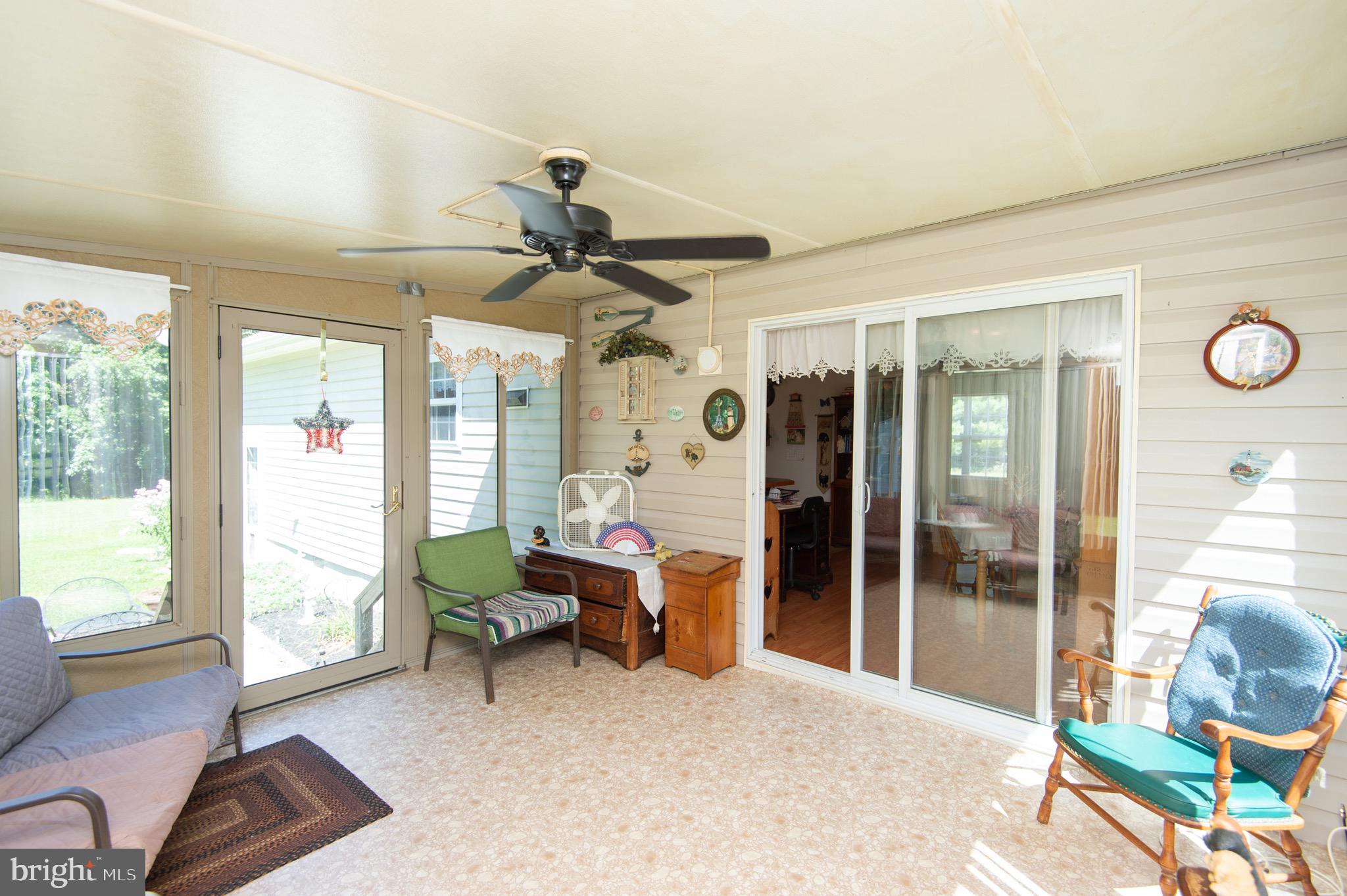 5834 Bell Creek Road Preston, MD 21655 - Photo 36 of 44 a living room with furniture and a large window