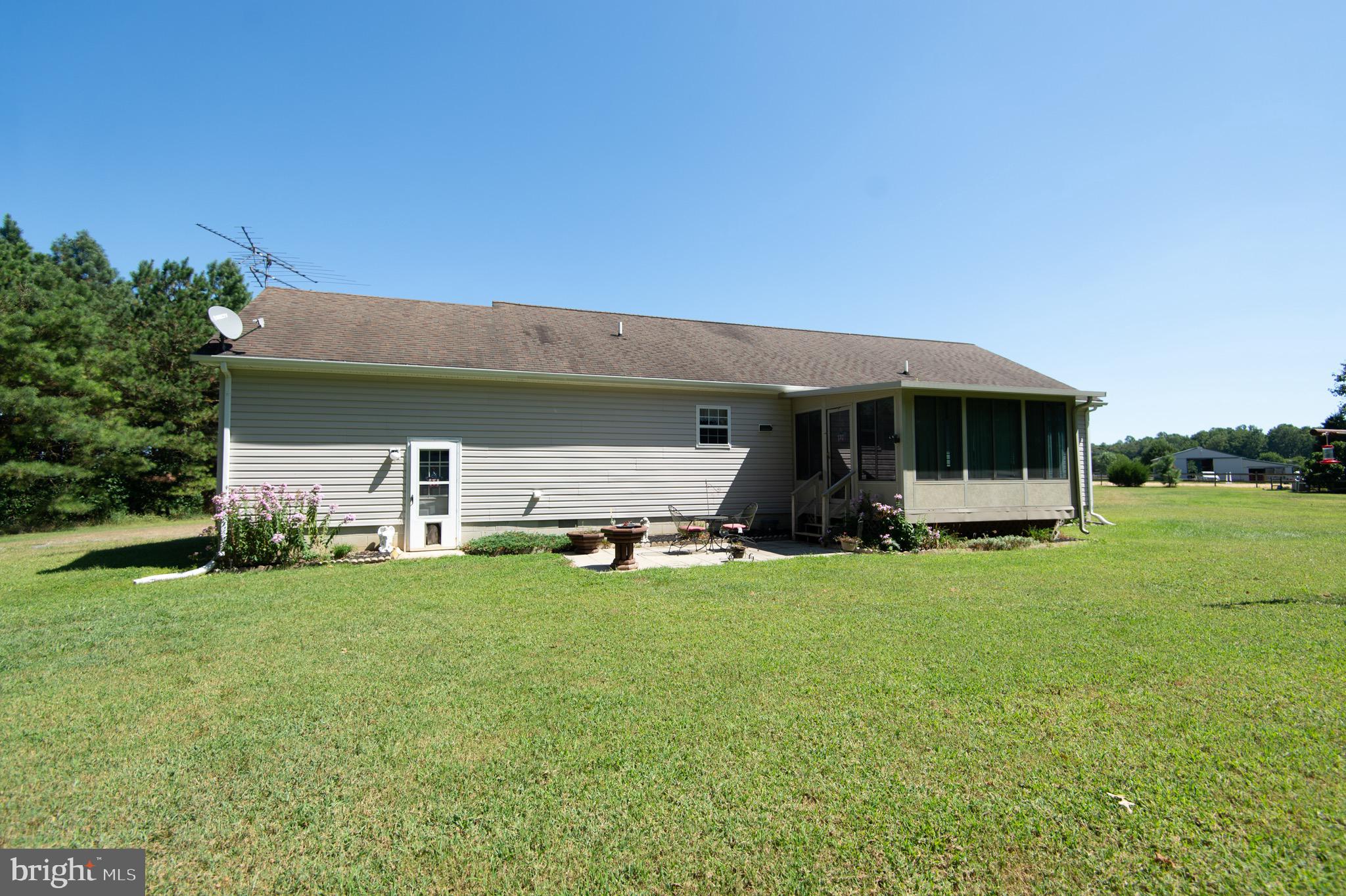 5834 Bell Creek Road Preston, MD 21655 - Photo 39 of 44 a view of a house with backyard and porch
