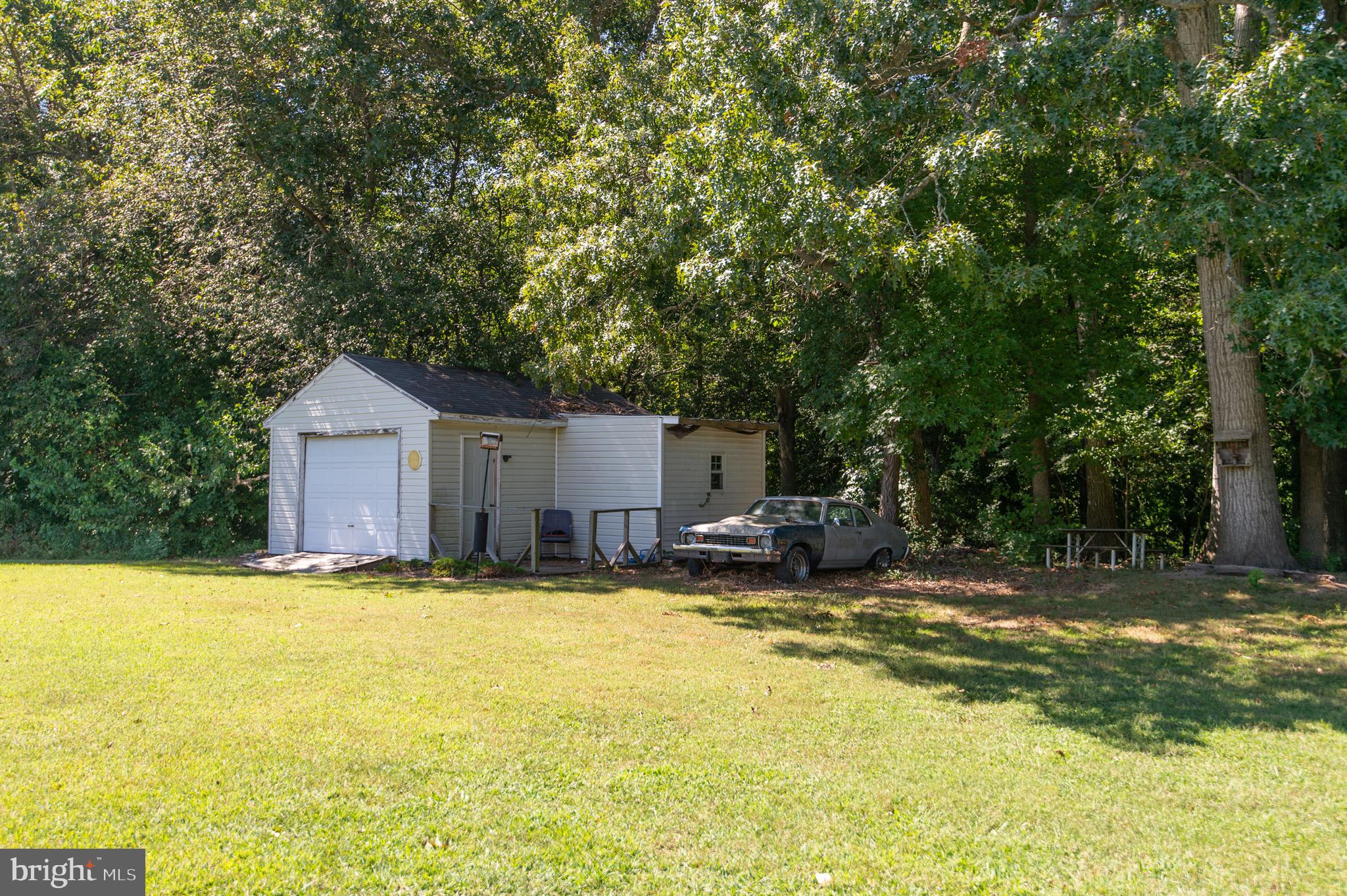 5834 Bell Creek Road Preston, MD 21655 - Photo 43 of 44 a view of a house with swimming pool and sitting area