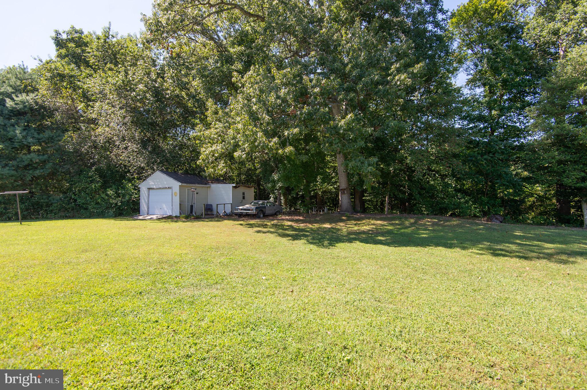 5834 Bell Creek Road Preston, MD 21655 - Photo 44 of 44 a swimming pool with outdoor seating and yard