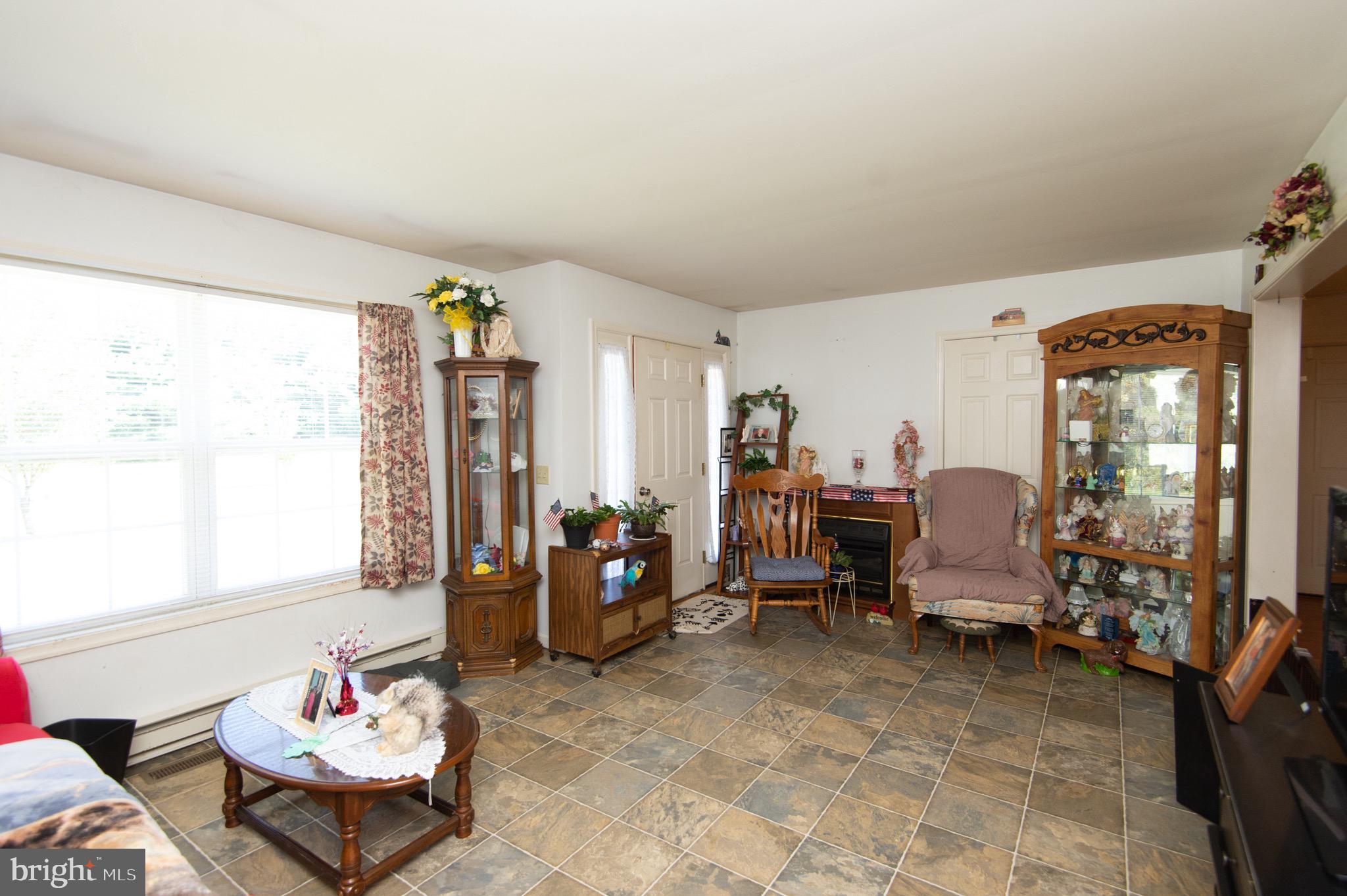 5834 Bell Creek Road Preston, MD 21655 - Photo 10 of 44 a living room with furniture and a large window