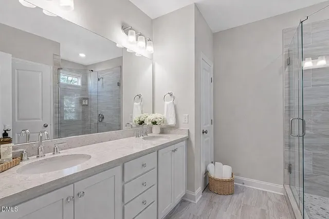 a large kitchen with stainless steel appliances kitchen island a large counter top and a stove top oven