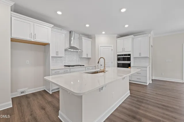 a bathroom with a double vanity sink and mirror