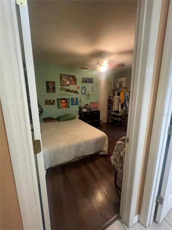 396 Kettering Road Deltona, FL 32725 - Photo 23 of 25 a bed room with a bed and furniture