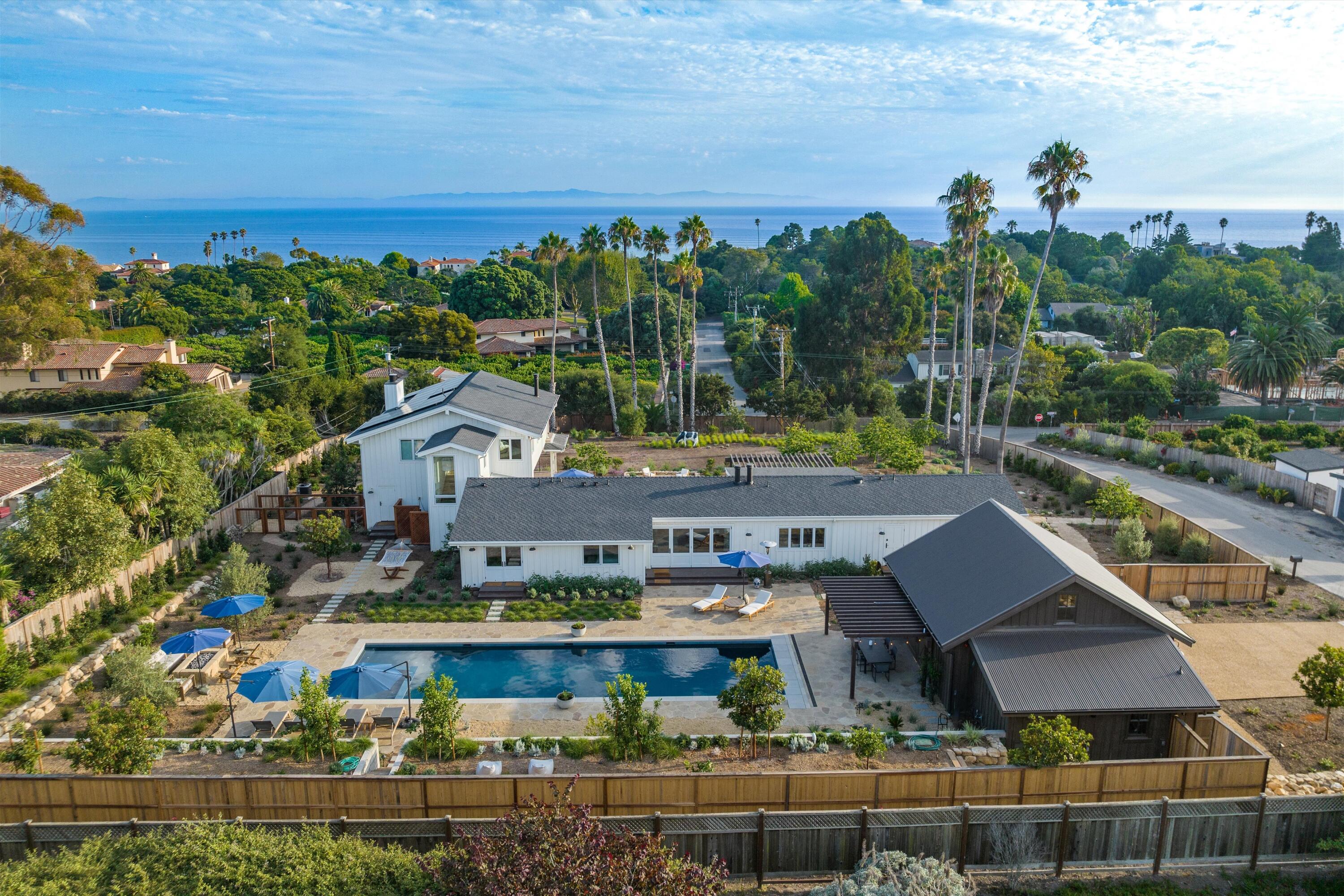 7 Yankee Farm Road Santa Barbara, CA 93109 - Photo 1 of 33 a view of a city with lawn chairs and large trees