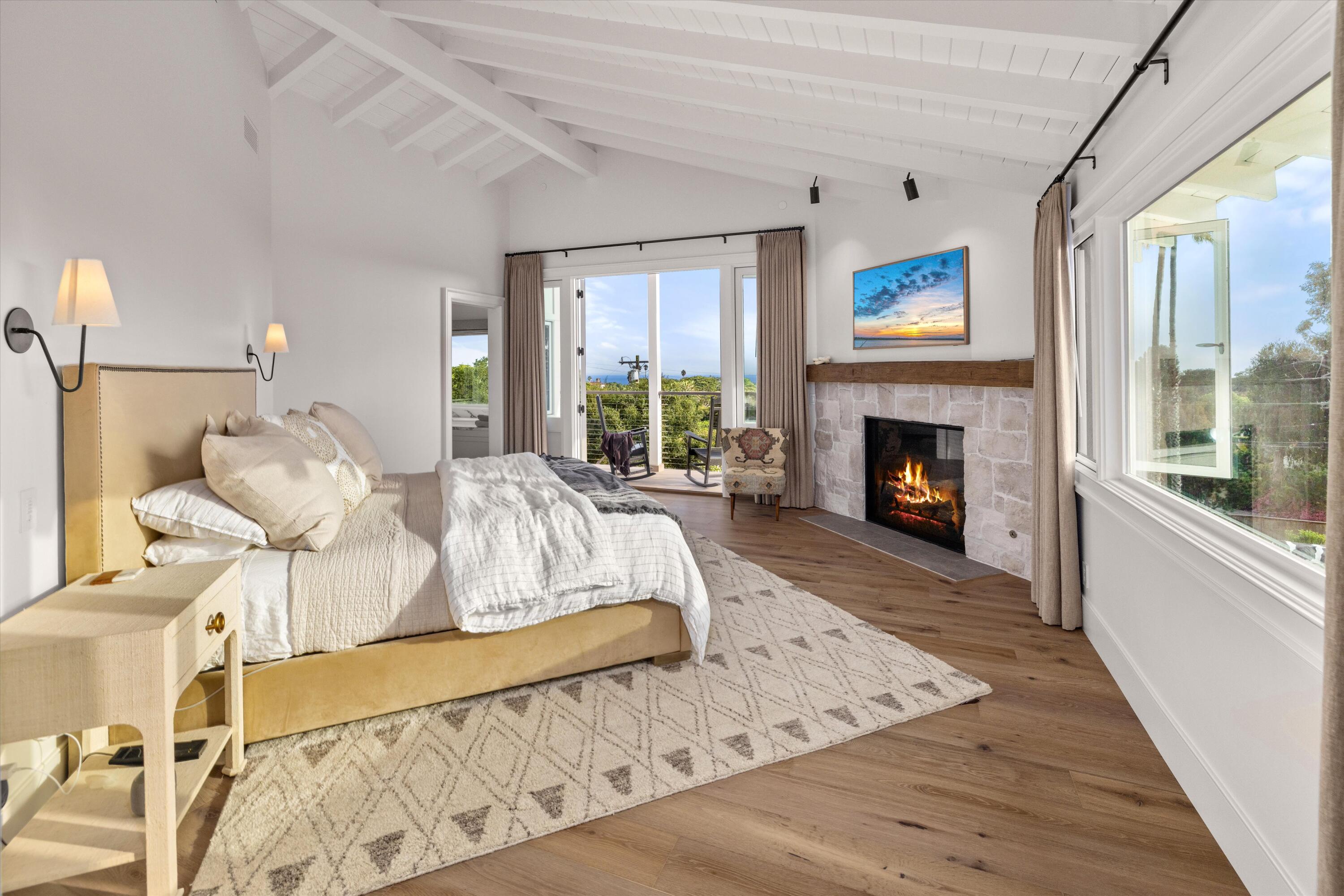 7 Yankee Farm Road Santa Barbara, CA 93109 - Photo 13 of 33 a living room with furniture large window and a fireplace