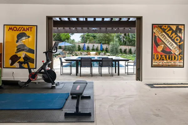 a view of a livingroom with furniture window and a floor to ceiling window