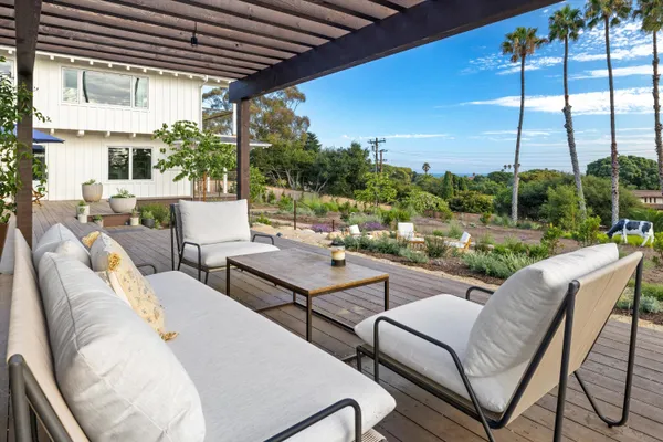 a view of a patio with couches chairs dining table and chairs