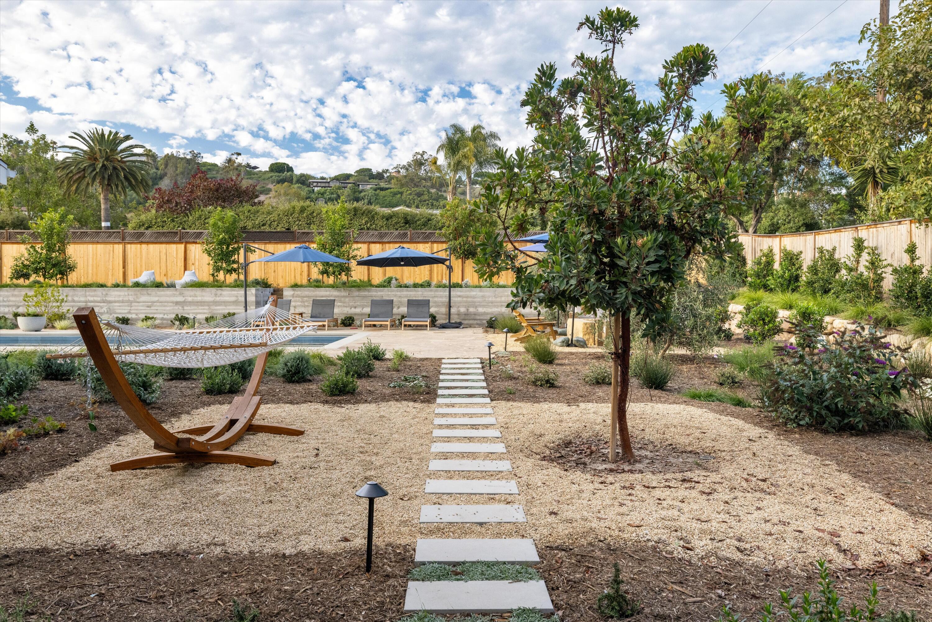 7 Yankee Farm Road Santa Barbara, CA 93109 - Photo 24 of 33 a view of a patio with table and chairs and potted plants