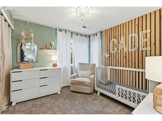 a view of a bedroom with furniture and windows
