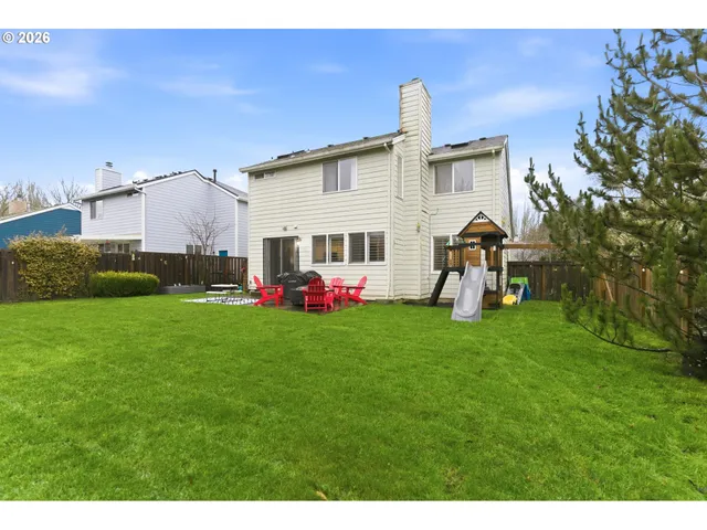 a view of a backyard with sitting area
