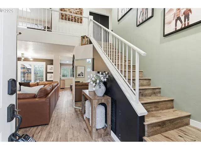 a view of living room with furniture and stairs