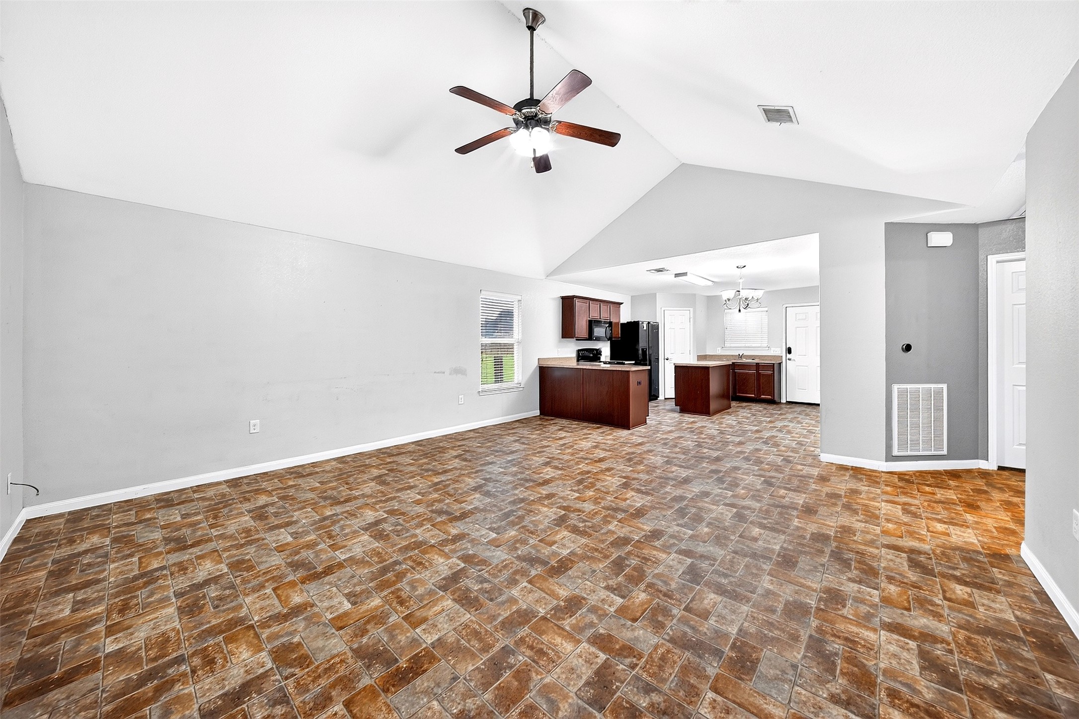 148 Fear Road Winnie, TX 77665 - Photo 6 of 34 Large spacious living space opens up to kitchen.