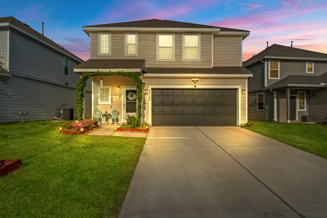 a front view of a house with a yard