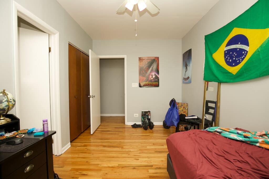 4511 Malden Street, Unit 3B Chicago, IL 60640 - Photo 16 of 20 a bedroom with a bed and a lamp on dresser