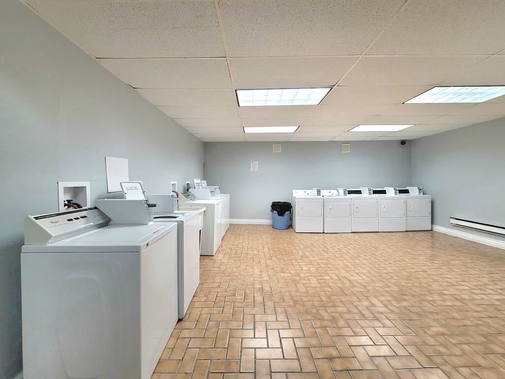 4511 Malden Street, Unit 3B Chicago, IL 60640 - Photo 20 of 20 a kitchen with a sink a stove cabinets and utility room