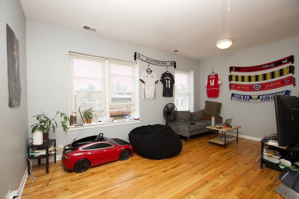 4511 Malden Street, Unit 3B Chicago, IL 60640 - Photo 2 of 20 a bed room with a bed and a chair