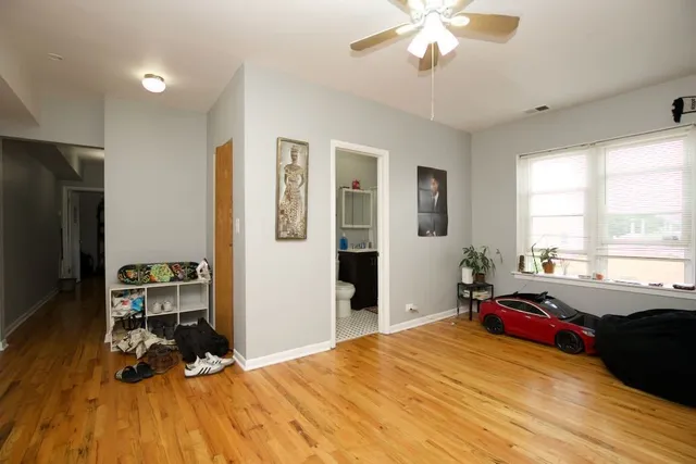 a bed room with a bed and a chandelier