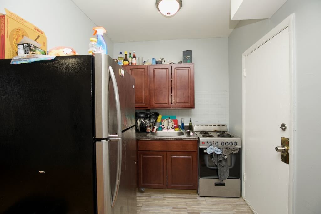 4511 Malden Street, Unit 3B Chicago, IL 60640 - Photo 10 of 20 a view of a kitchen with fridge and workspace
