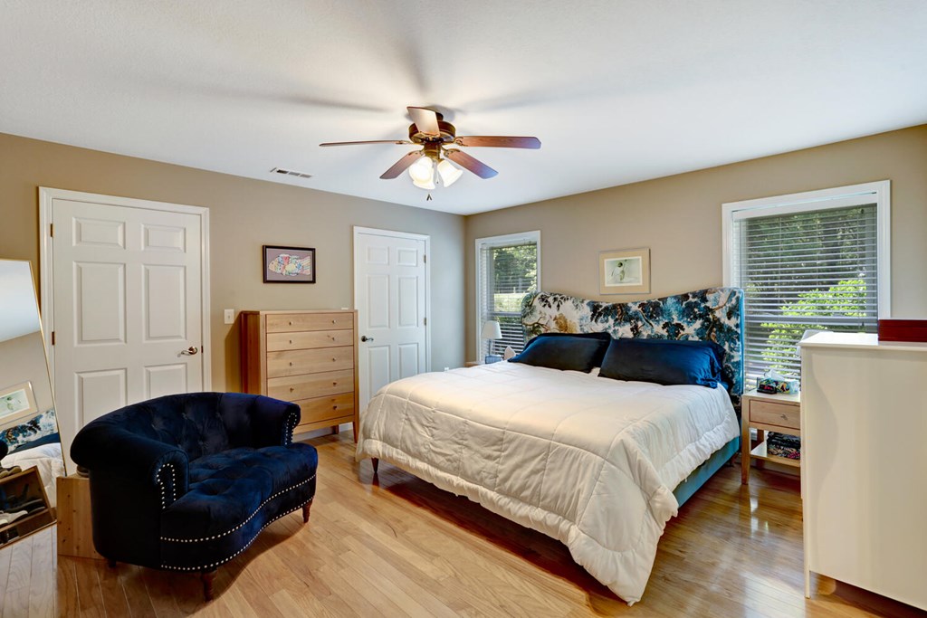 100 Dawson Way Blue Ridge, GA 30513 - Photo 13 of 37 a bedroom with a bed and wooden floor