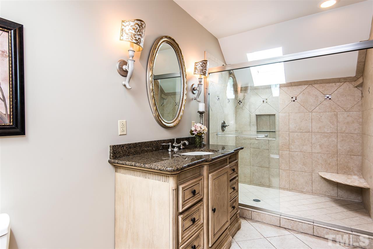 8200 Eden Close Court Raleigh, NC 27613 - Photo 11 of 15 a bathroom with a sink and a mirror
