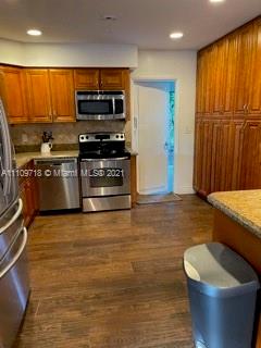 49 Southwest 9th Avenue Boca Raton, FL 33486 - Photo 1 of 8 a kitchen with stainless steel appliances a stove a sink and a microwave