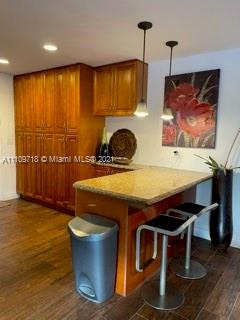 49 Southwest 9th Avenue Boca Raton, FL 33486 - Photo 4 of 8 a kitchen with a stove a sink and a wooden cabinets